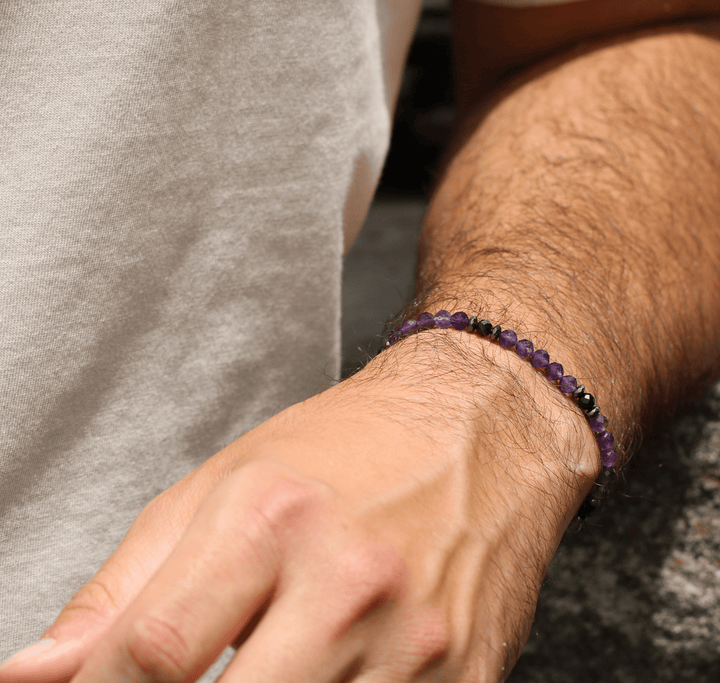 Amethyst Element bracelet shown close on a wrist against a neutral shirt