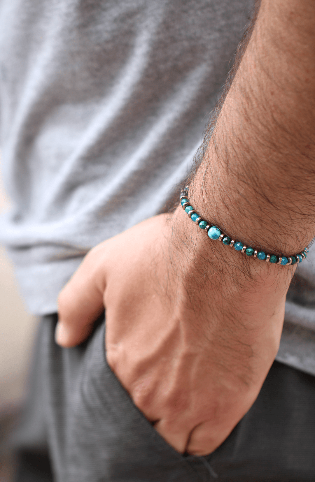 Earthrise malachite chrysocolla bracelet worn alone in a close-up wrist view