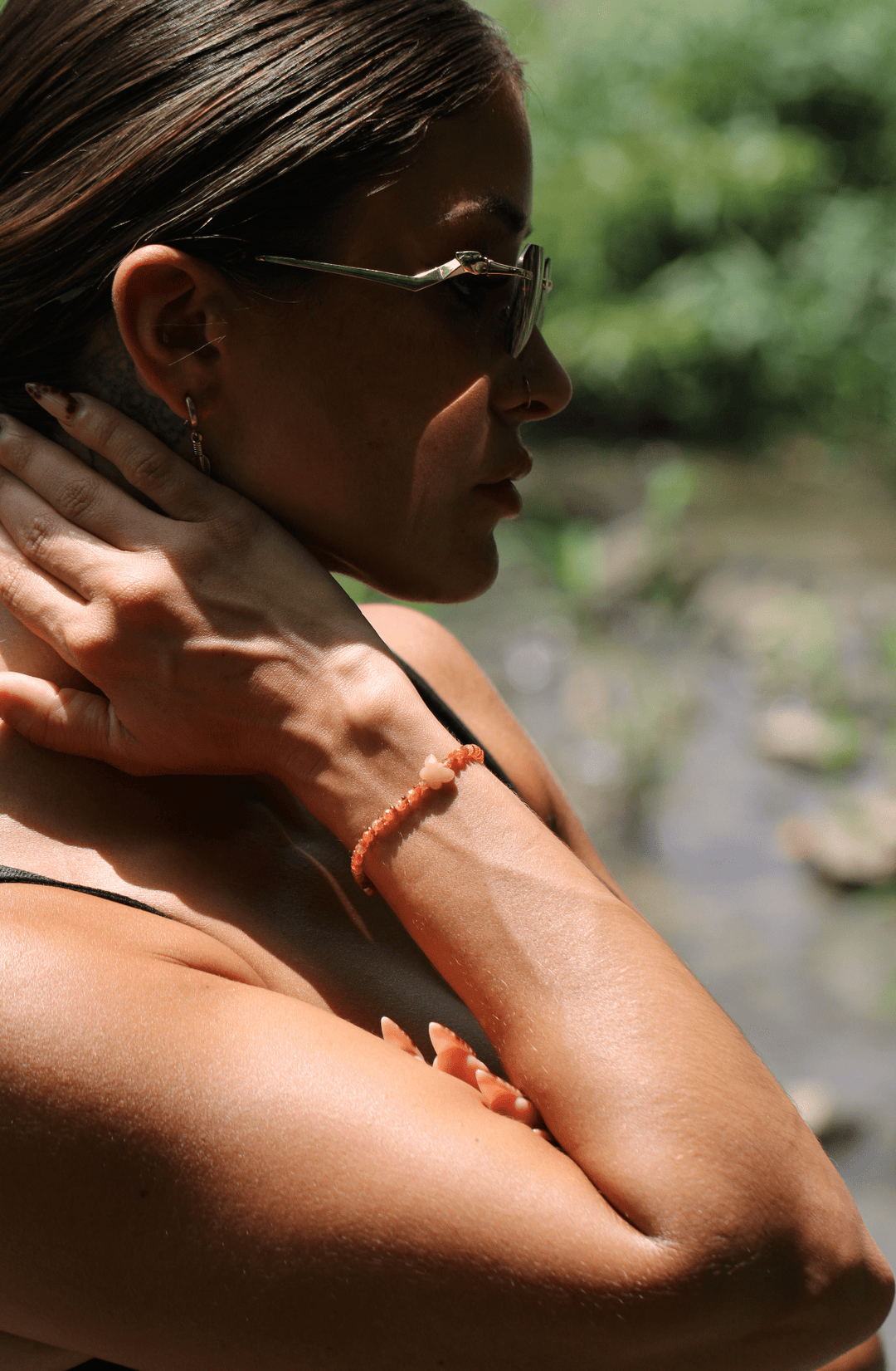 Monarch sunstone and aventurine butterfly bracelet on a model&