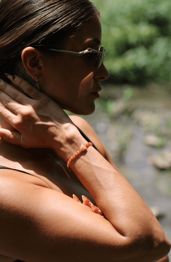 Monarch sunstone and aventurine butterfly bracelet on a model&