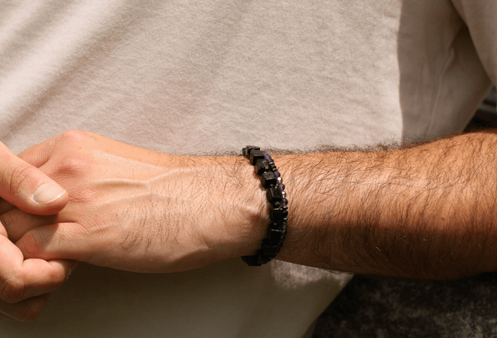 Amethyst Element and Paint It Black bracelets stacked on a model&