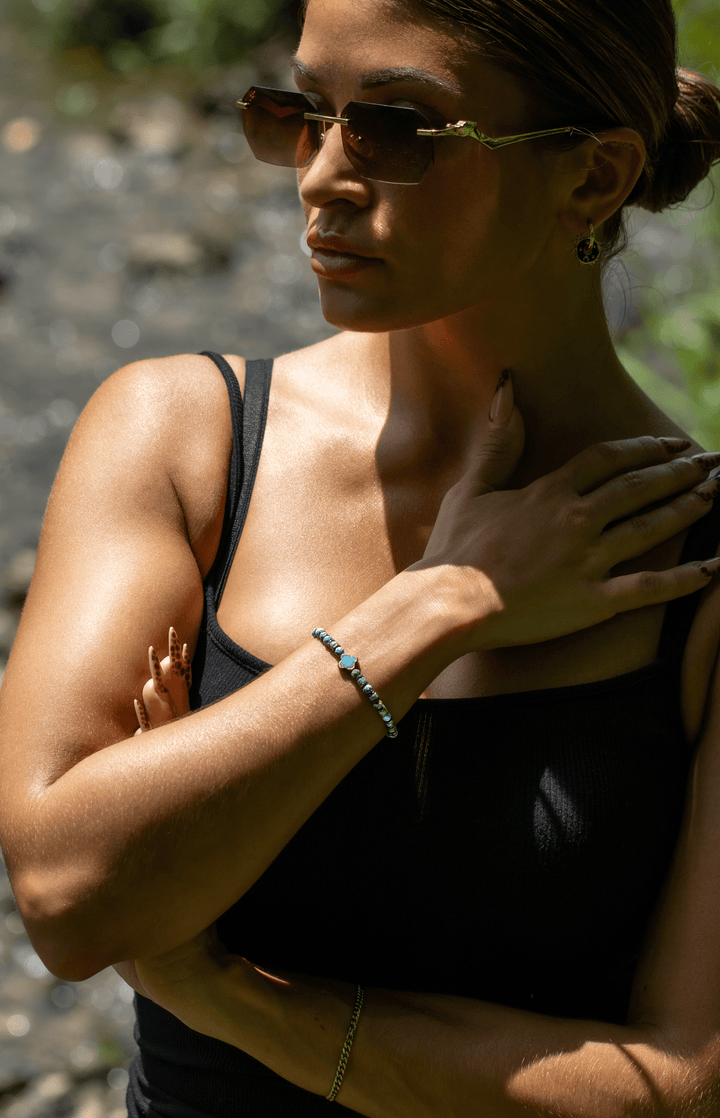 Patina Clove turquoise bracelet on a model&