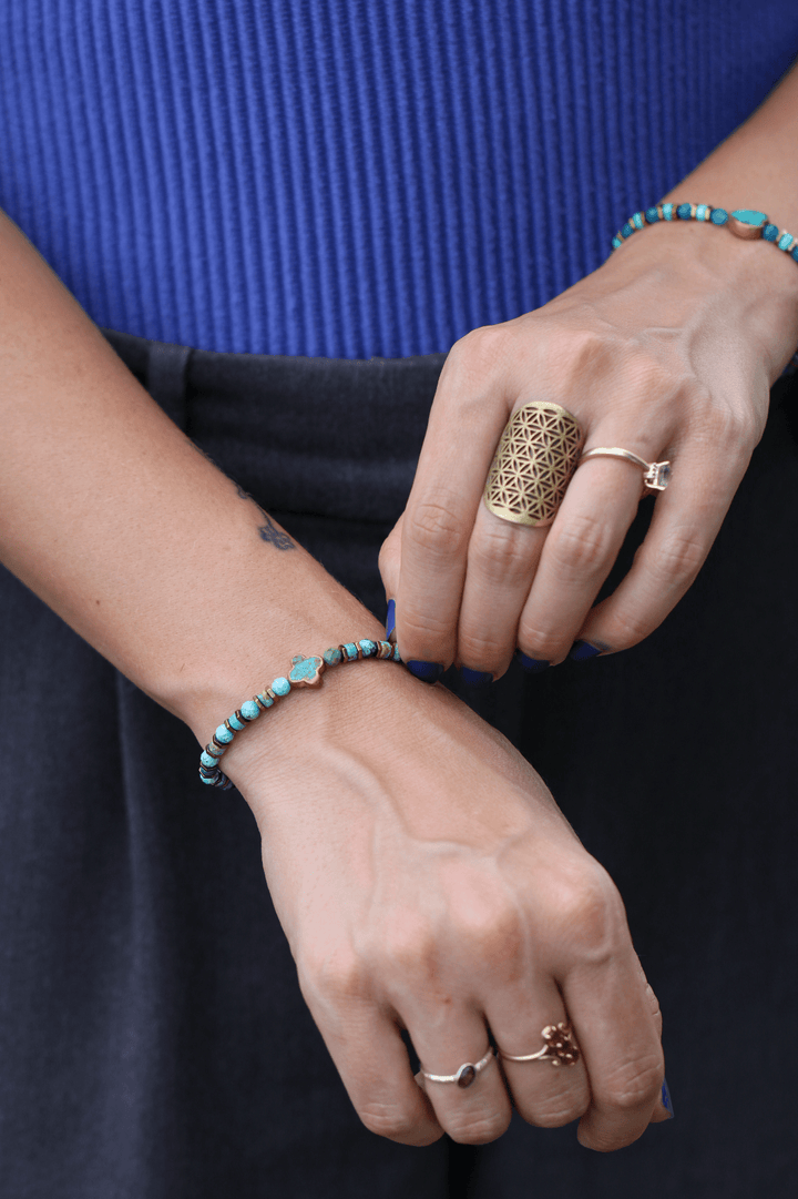 Patina Clove turquoise bracelet on a model&
