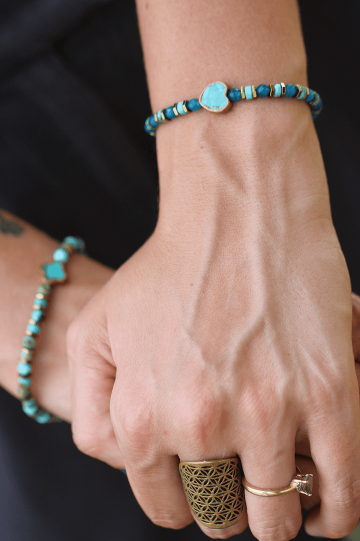 Patina Heart bracelet close-up on a wrist beside the Patina Clove bracelet