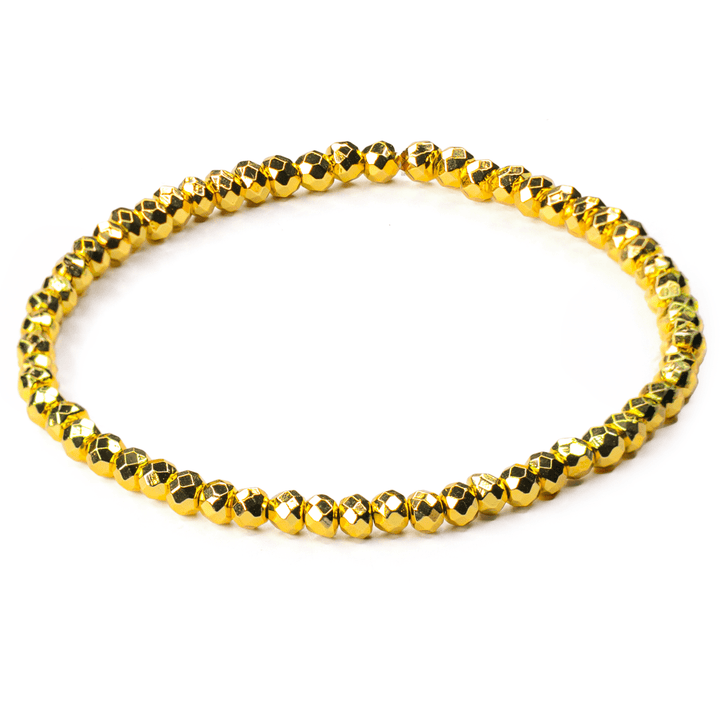 Titanium Hematite Rondelle stretch bracelet with faceted gold-tone beads on white